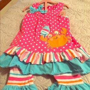 A new net girls size 6 multicolored crabby outfit.